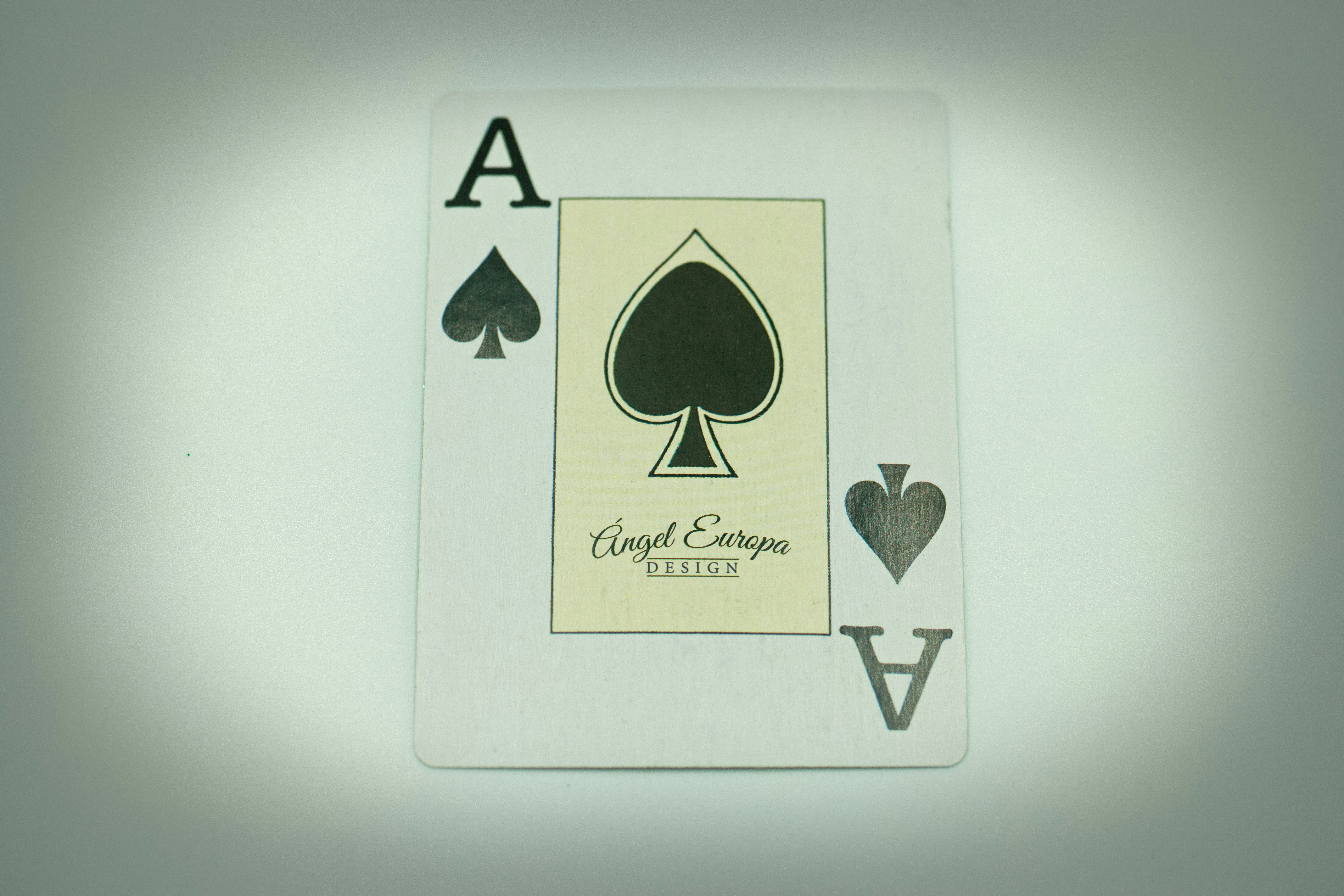 a playing card with a ace of spades on it